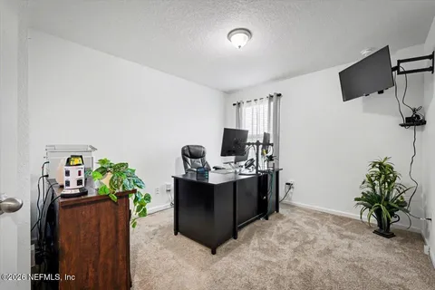 a view of a workspace with furniture