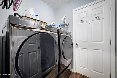 a utility room with dryer and washer