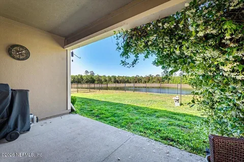 a view of a lake with a big yard