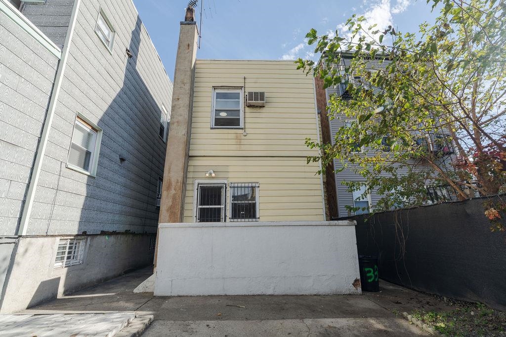 337 Summit Avenue, Unit 1 Jersey City, NJ 07306 - Photo 17 of 26 a view of a house with a tree