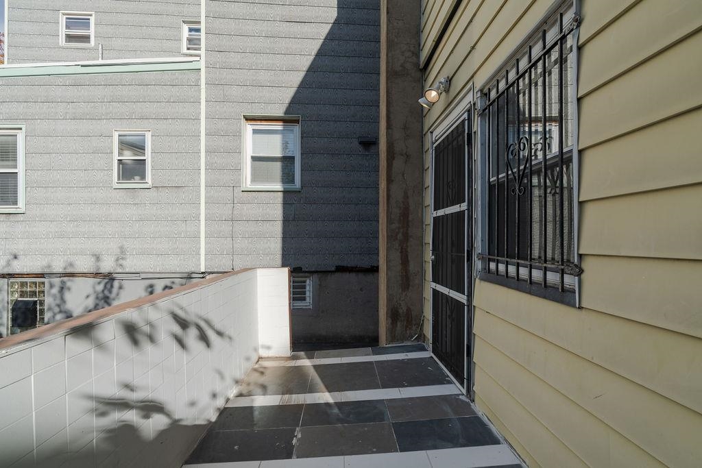 337 Summit Avenue, Unit 1 Jersey City, NJ 07306 - Photo 20 of 26 a view of a balcony with a potted plant