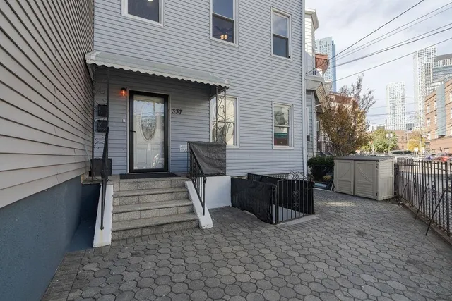 a view of a patio with table and chairs in a patio