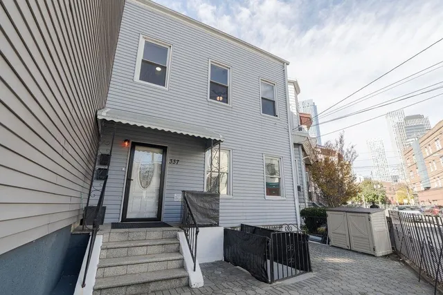 a view of a deck with wooden floor and roof with a sink