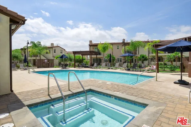 a view of a swimming pool with a patio