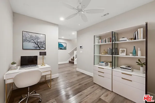 a room with furniture and a book shelf