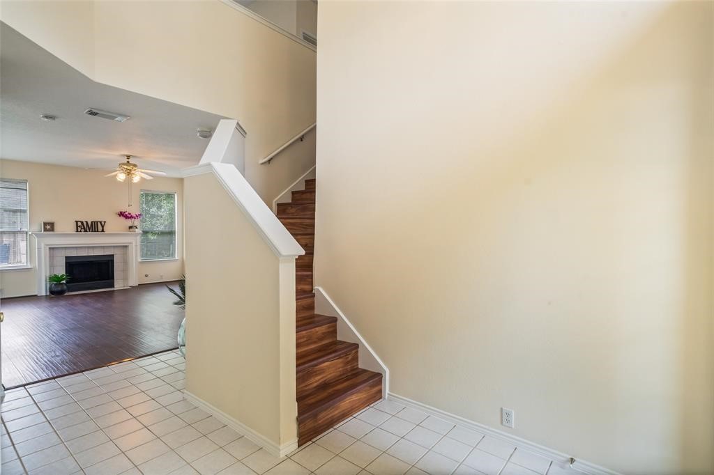 11011 Hunting Path Court Houston, TX 77065 - Photo 18 of 31 a view of a livingroom with wooden floor and a fireplace