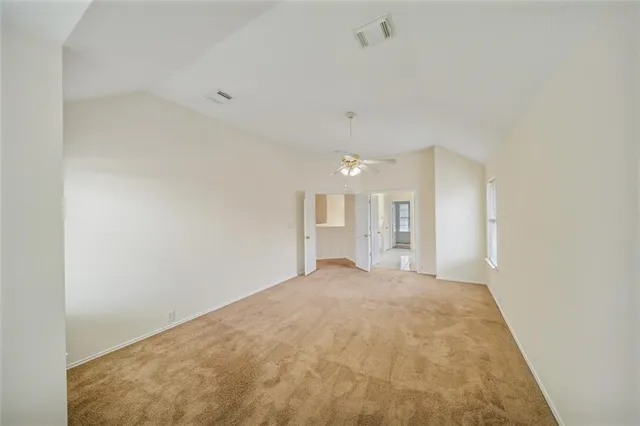 a view of a big room with windows and cabinet