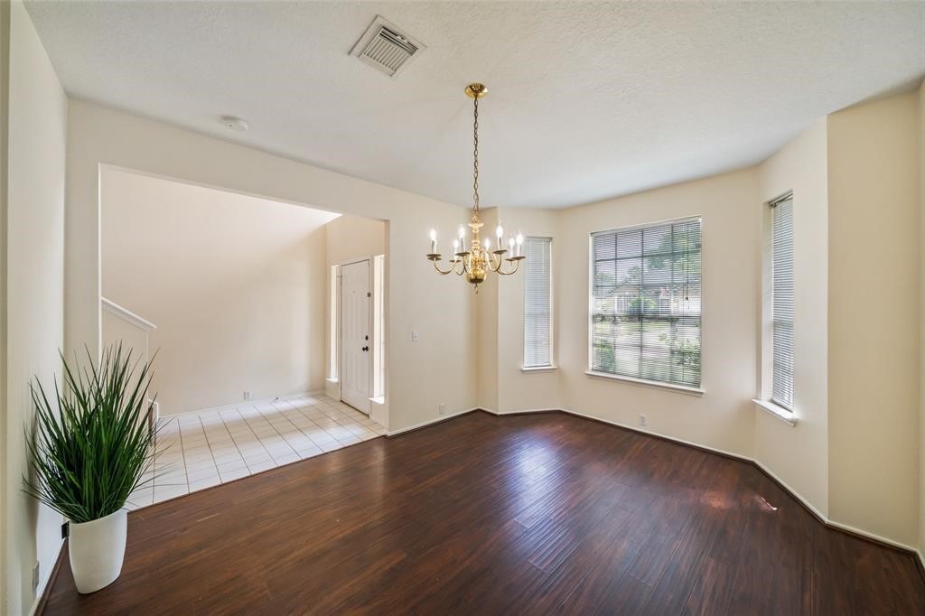 11011 Hunting Path Court Houston, TX 77065 - Photo 3 of 31 a view of a room with wooden floor chandelier and entryway