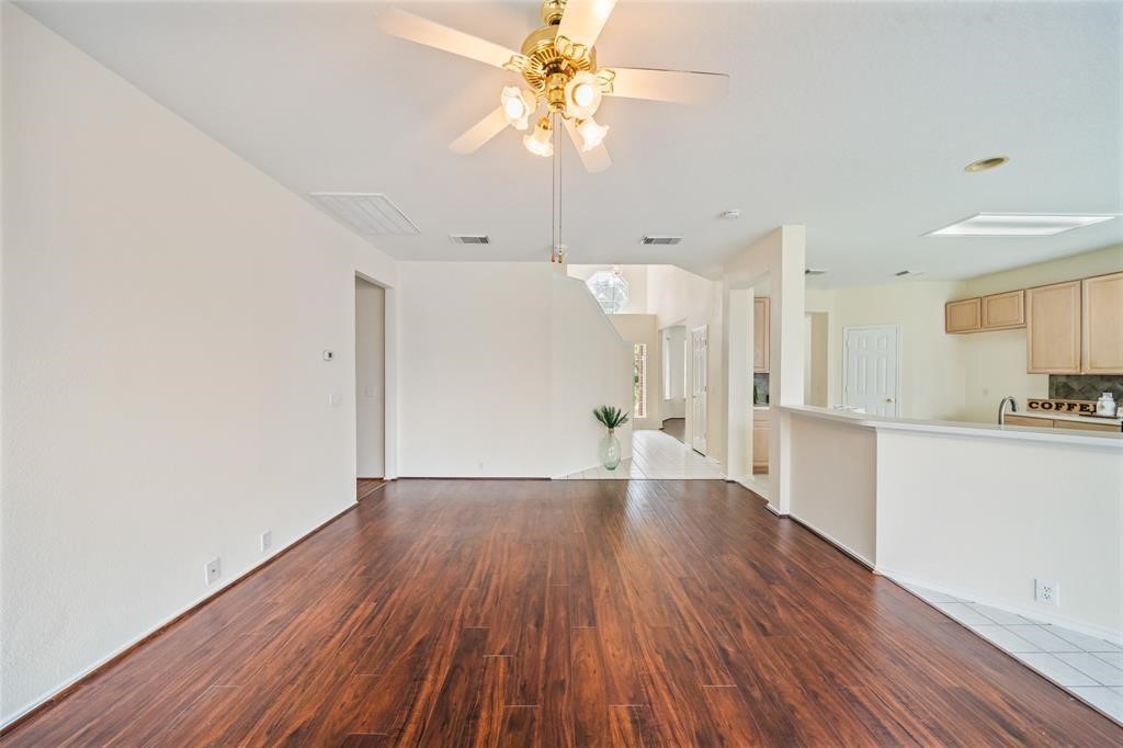 11011 Hunting Path Court Houston, TX 77065 - Photo 6 of 31 a view of a kitchen with wooden floor and a sink