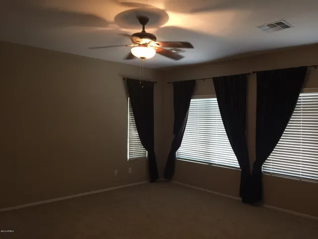 a view of entryway and kitchen
