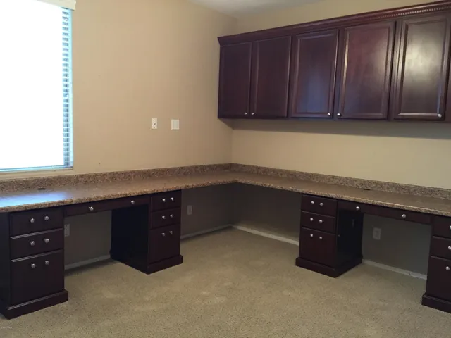 a room with a cabinets and a sink