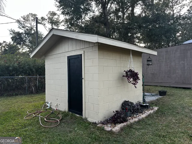 a backyard of a house with lots of green space