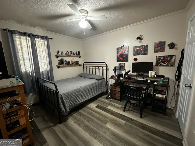 a bedroom with furniture and a window