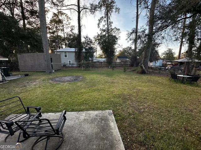 a backyard of a house with lots of green space