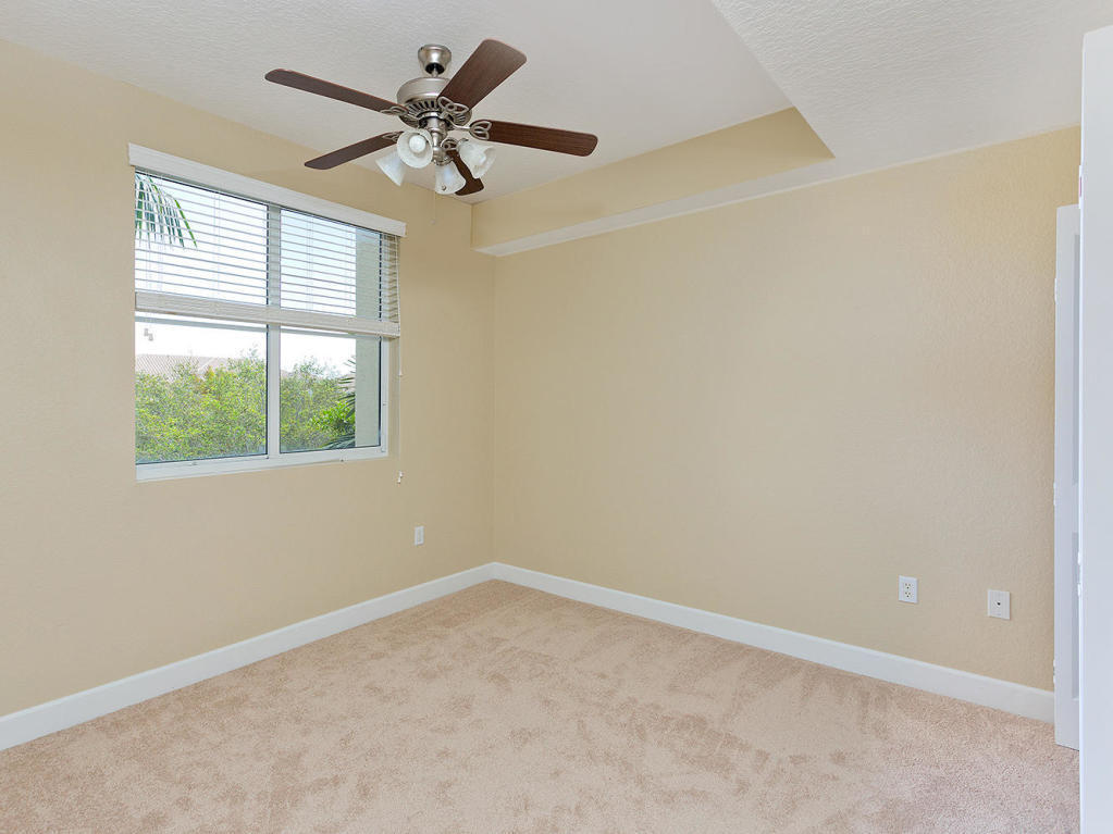 4 Renaissance Way, Unit 303 Boynton Beach, FL 33426 - Photo 20 of 26 an empty room with a window and a fan