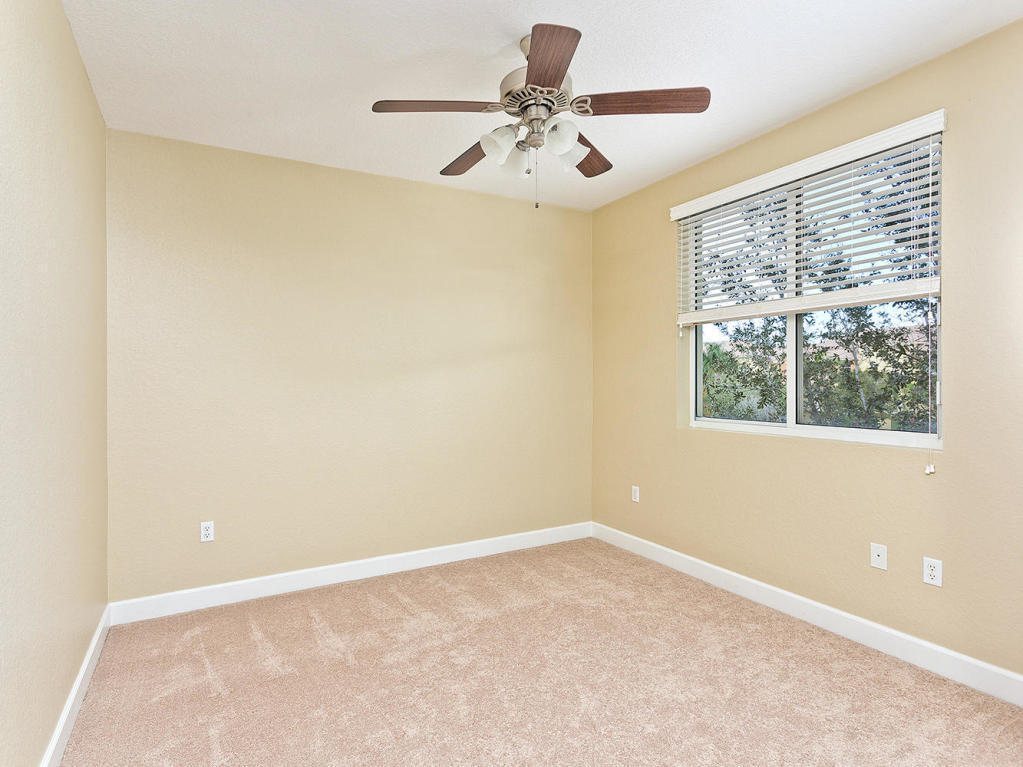 4 Renaissance Way, Unit 303 Boynton Beach, FL 33426 - Photo 22 of 26 a view of a big room with windows and chandelier fan