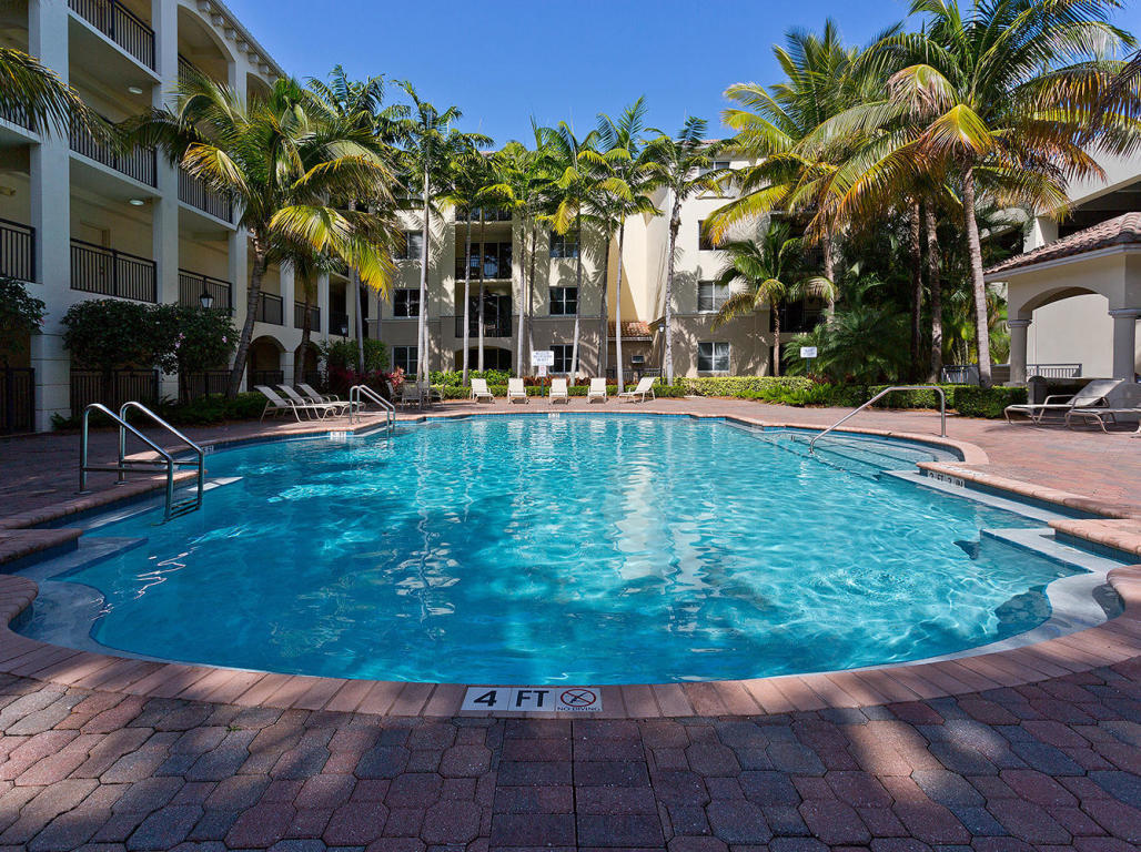 4 Renaissance Way, Unit 303 Boynton Beach, FL 33426 - Photo 24 of 26 a view of a swimming pool with a patio