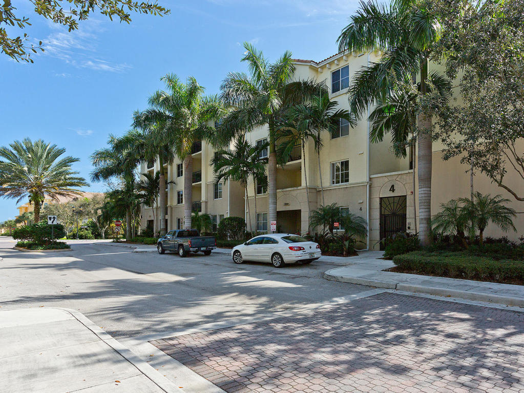 4 Renaissance Way, Unit 303 Boynton Beach, FL 33426 - Photo 3 of 26 a car parked in front of a house with a yard