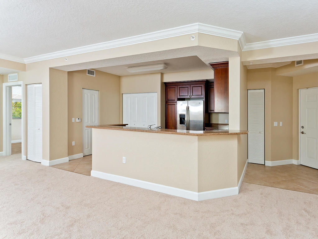 4 Renaissance Way, Unit 303 Boynton Beach, FL 33426 - Photo 5 of 26 a view of a hallway view with wooden floor and a living room