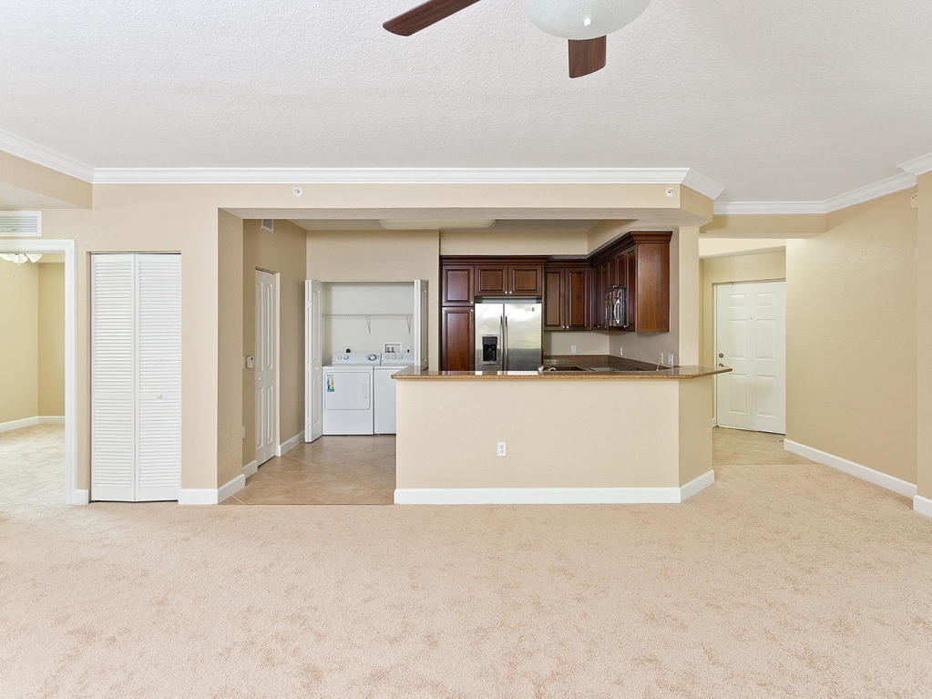 4 Renaissance Way, Unit 303 Boynton Beach, FL 33426 - Photo 6 of 26 a view of a big room with wooden floor and a kitchen