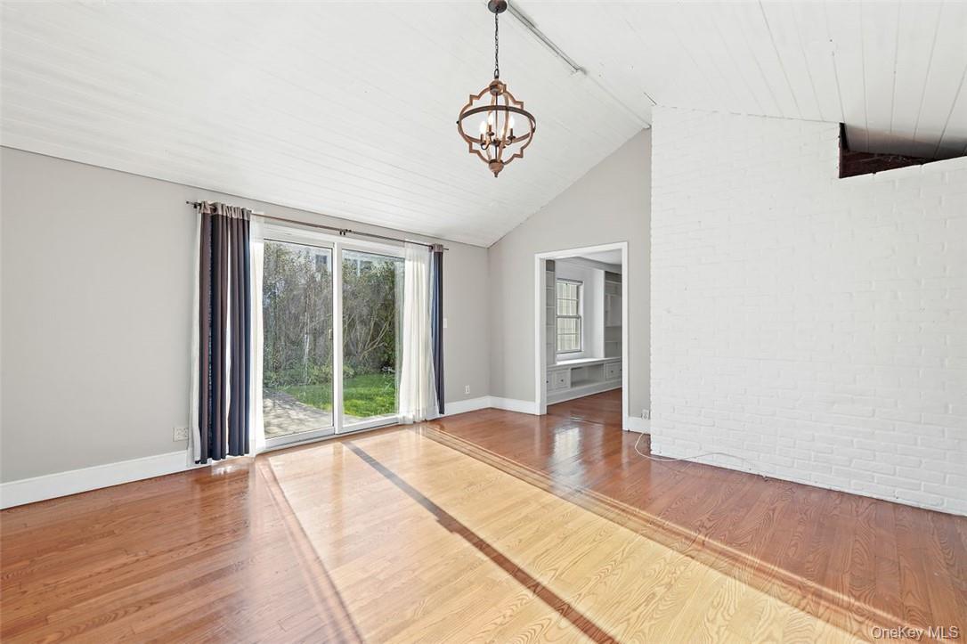 246 Mamaroneck Road Scarsdale, NY 10583 - Photo 6 of 35 Spacious family room with lofted ceiling and hardwood floors