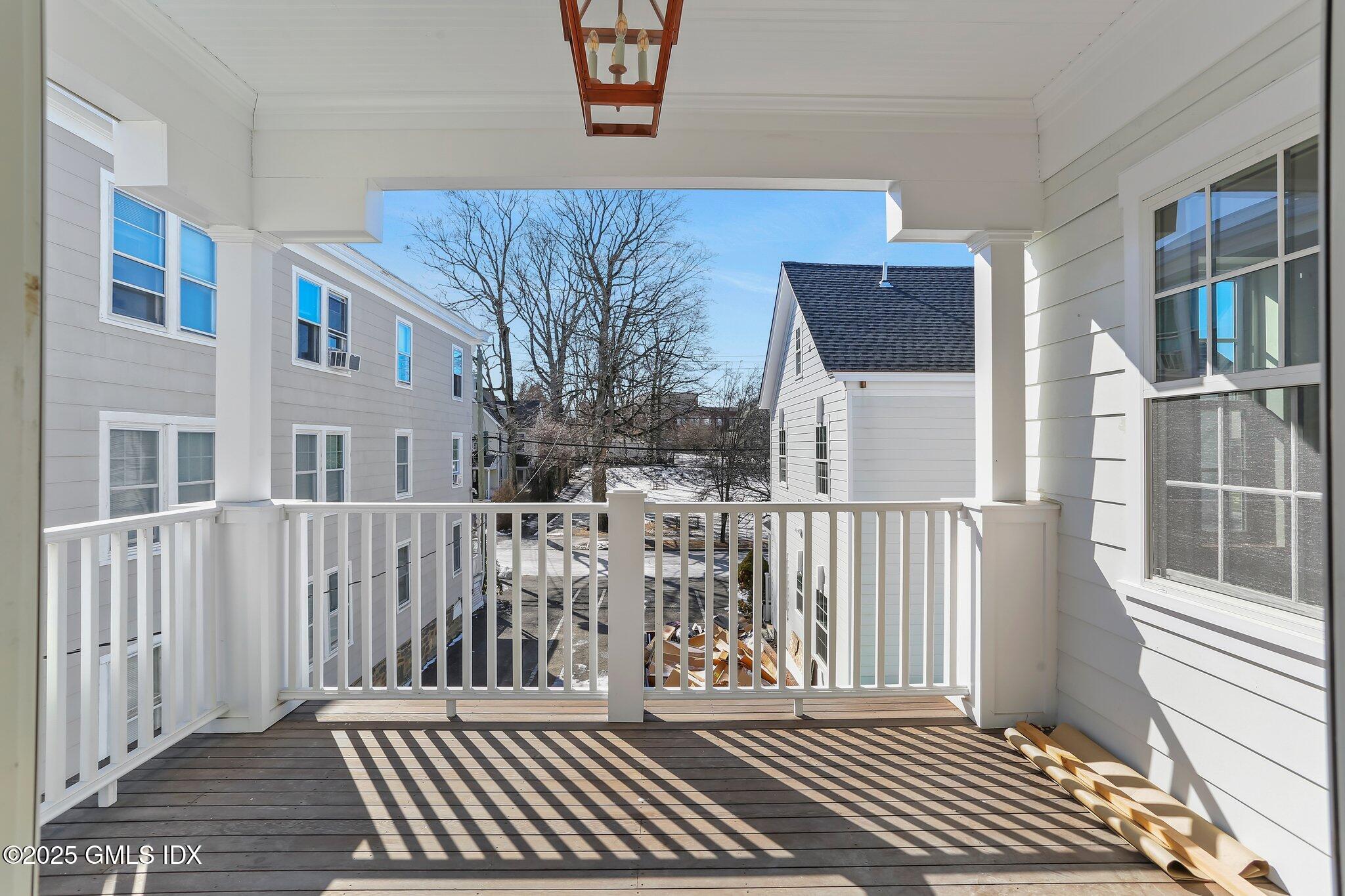 63 Church Street, Unit 2R Greenwich, CT 06830 - Photo 7 of 13 a view of a house with wooden deck