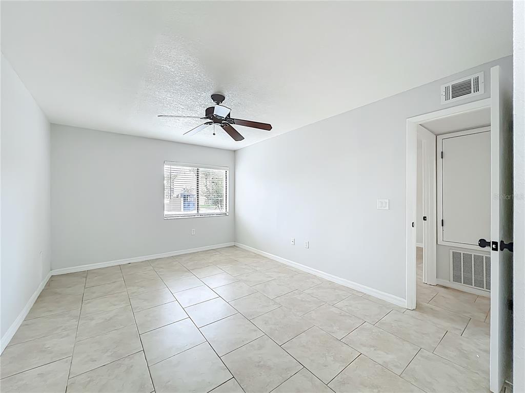 5249 Vineland Road Orlando, FL 32811 - Photo 28 of 42 a view of an empty room with a window