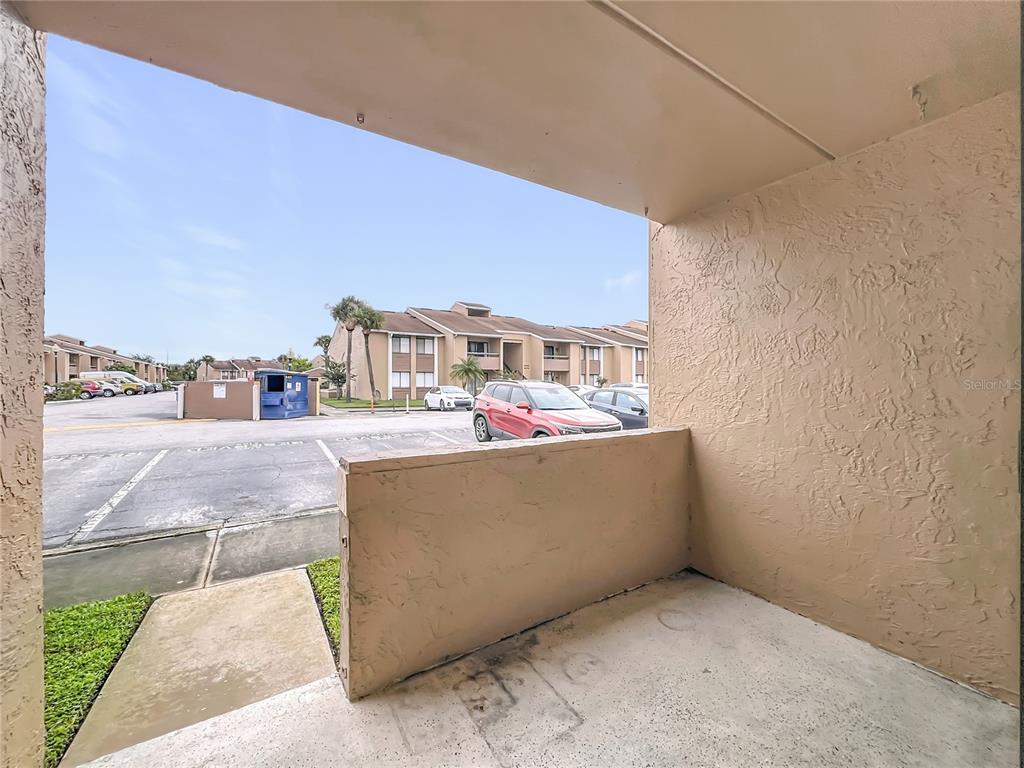 5249 Vineland Road Orlando, FL 32811 - Photo 36 of 42 a terrace with a bench and city view