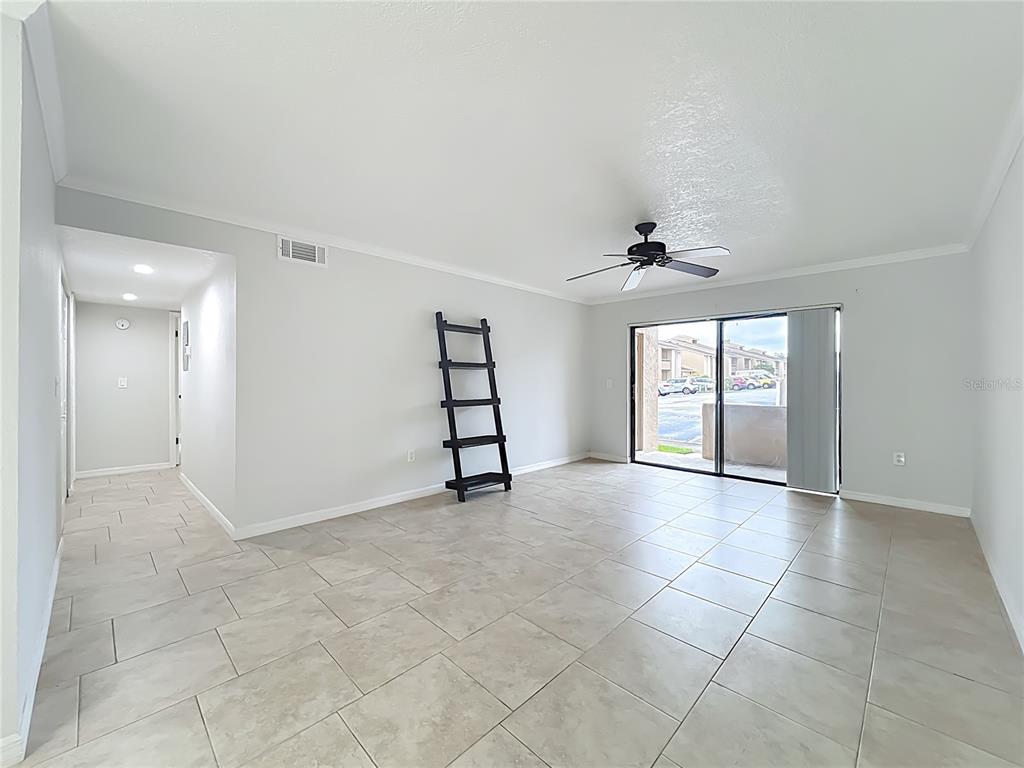 5249 Vineland Road Orlando, FL 32811 - Photo 6 of 42 a view of an empty room with a window