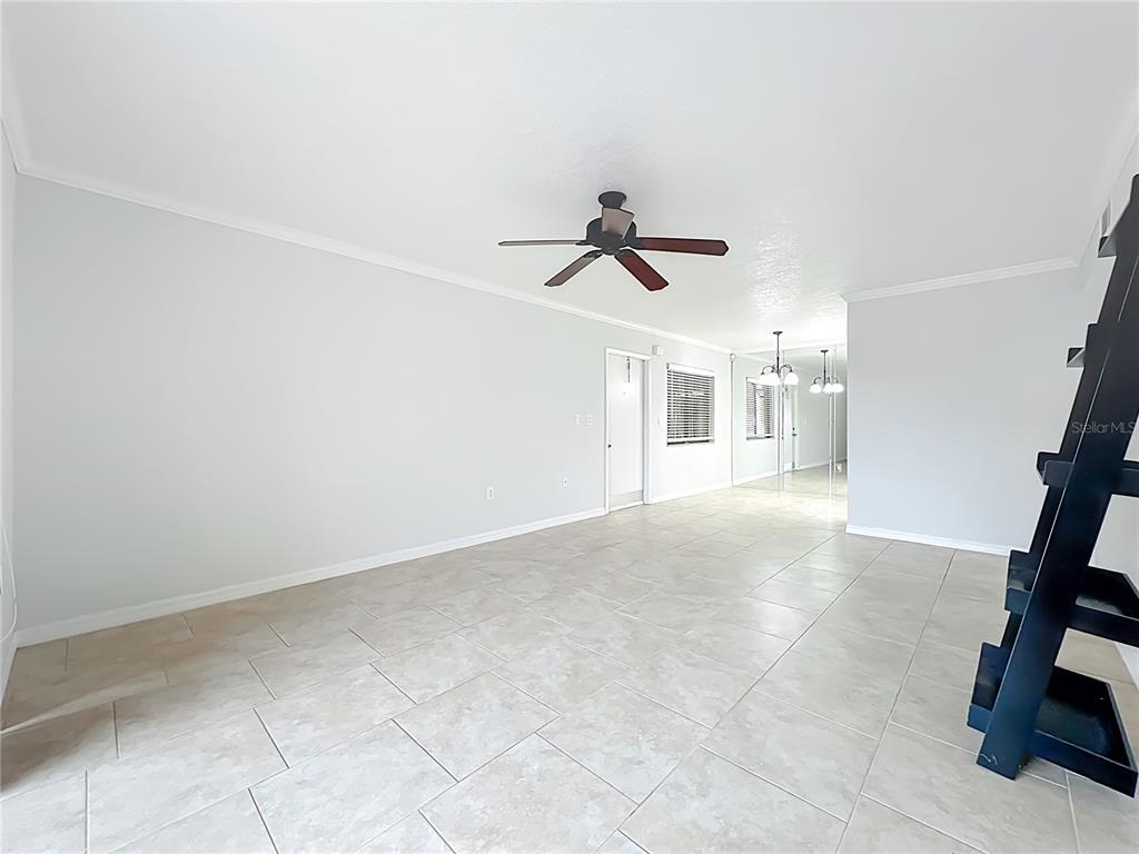 5249 Vineland Road Orlando, FL 32811 - Photo 8 of 42 a view of entryway and kitchen