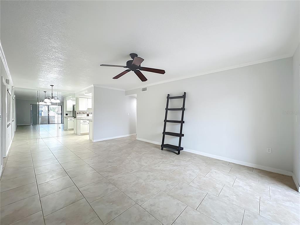 5249 Vineland Road Orlando, FL 32811 - Photo 9 of 42 wooden floor in an empty room