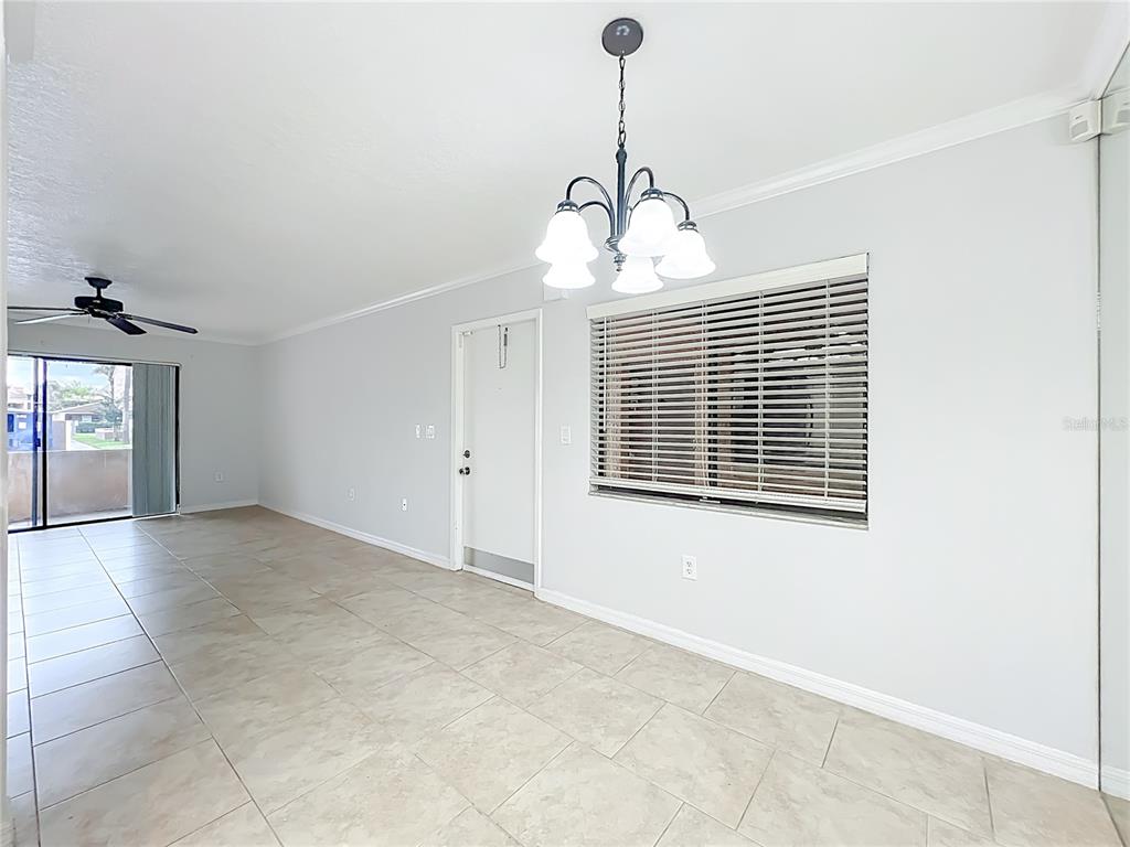 5249 Vineland Road Orlando, FL 32811 - Photo 10 of 42 a view of empty room with windows