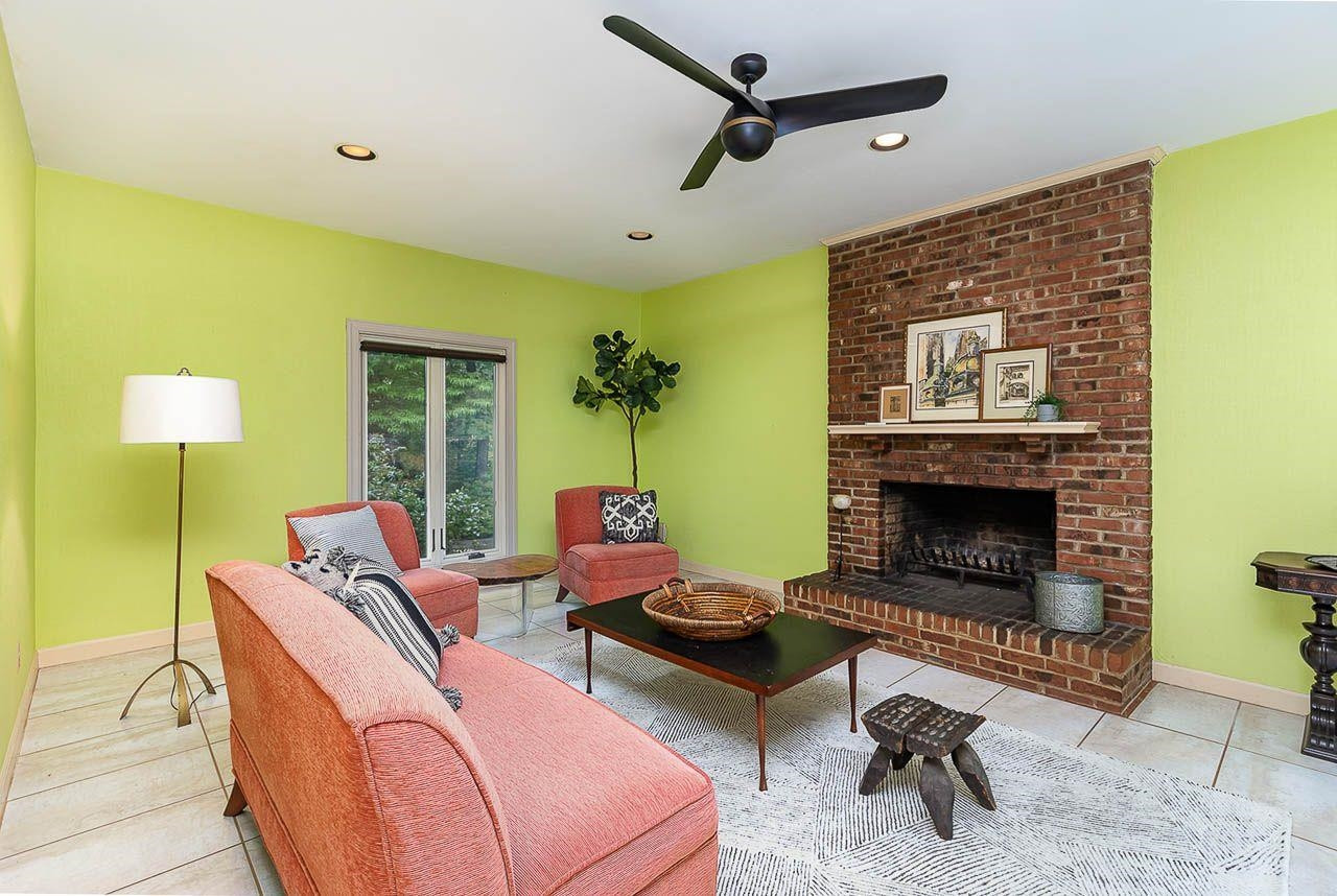212 Carpathian Way Raleigh, NC 27615 - Photo 25 of 31 Cozy family room with brick fireplace open to kitchen Family Room/keeping room