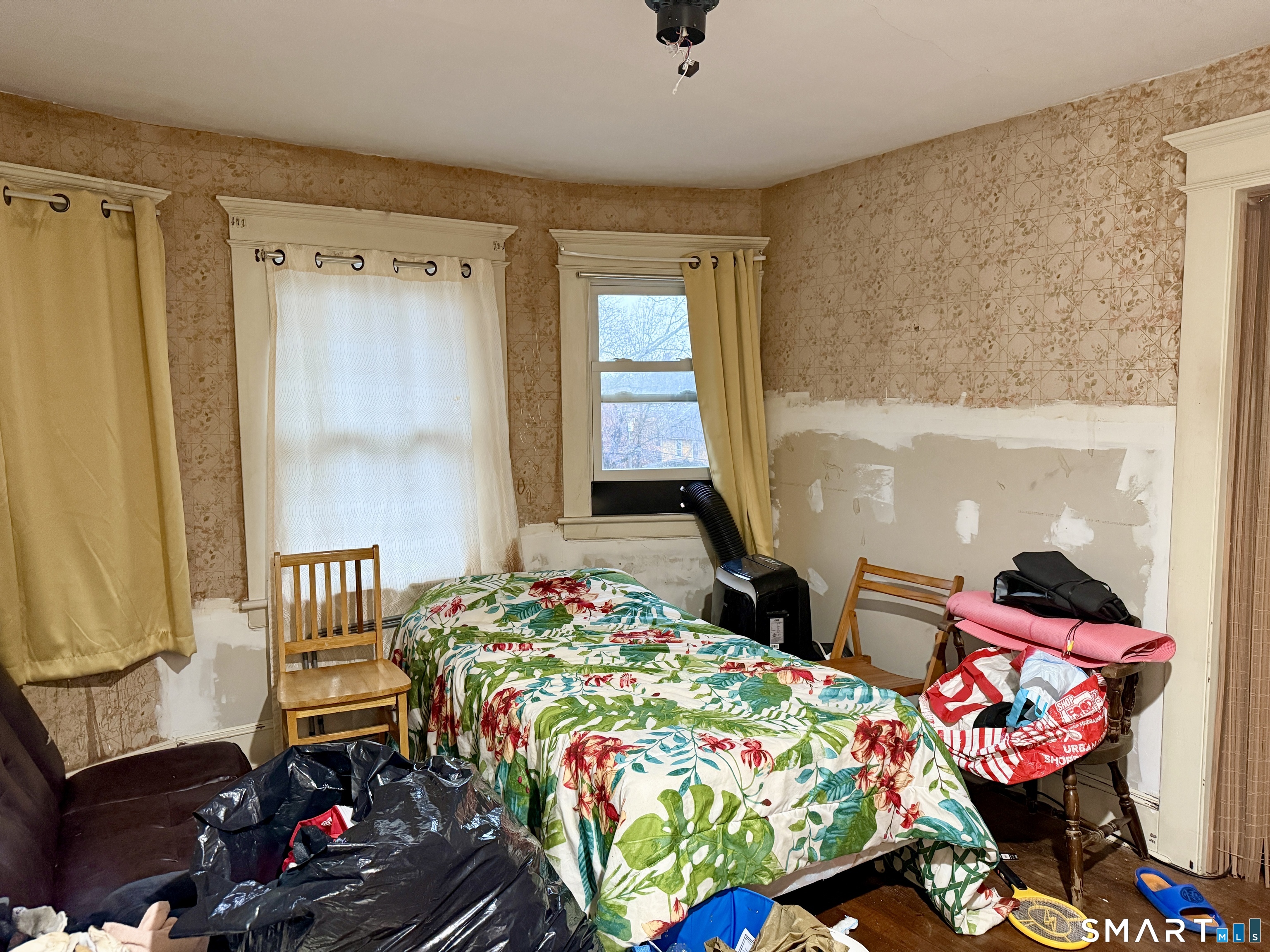 26 Victory Street Bridgeport, CT 06606 - Photo 19 of 32 a bedroom with bed and a window