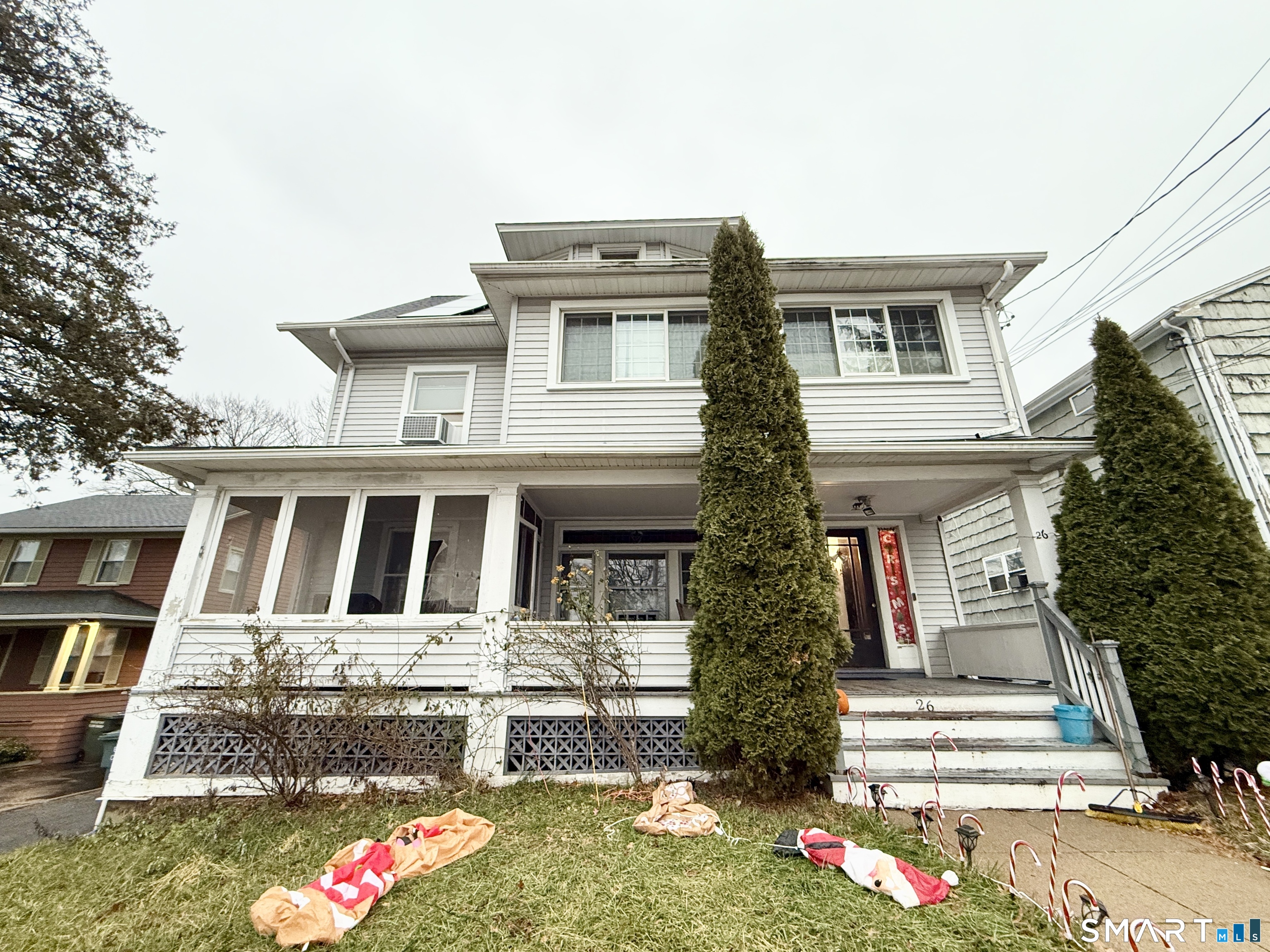 26 Victory Street Bridgeport, CT 06606 - Photo 2 of 32 a front view of a house with a yard