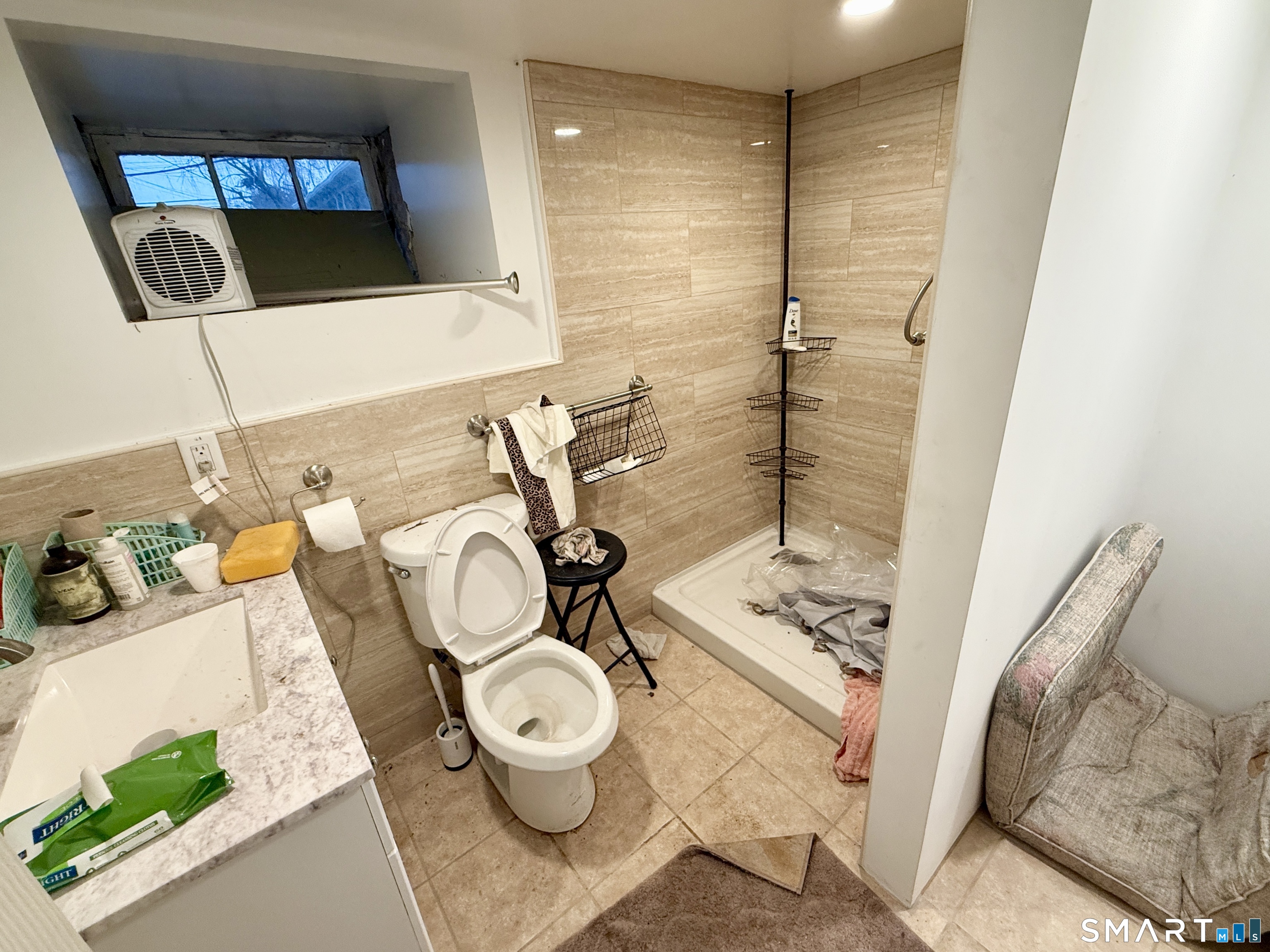 26 Victory Street Bridgeport, CT 06606 - Photo 23 of 32 a bathroom with a toilet and a mirror