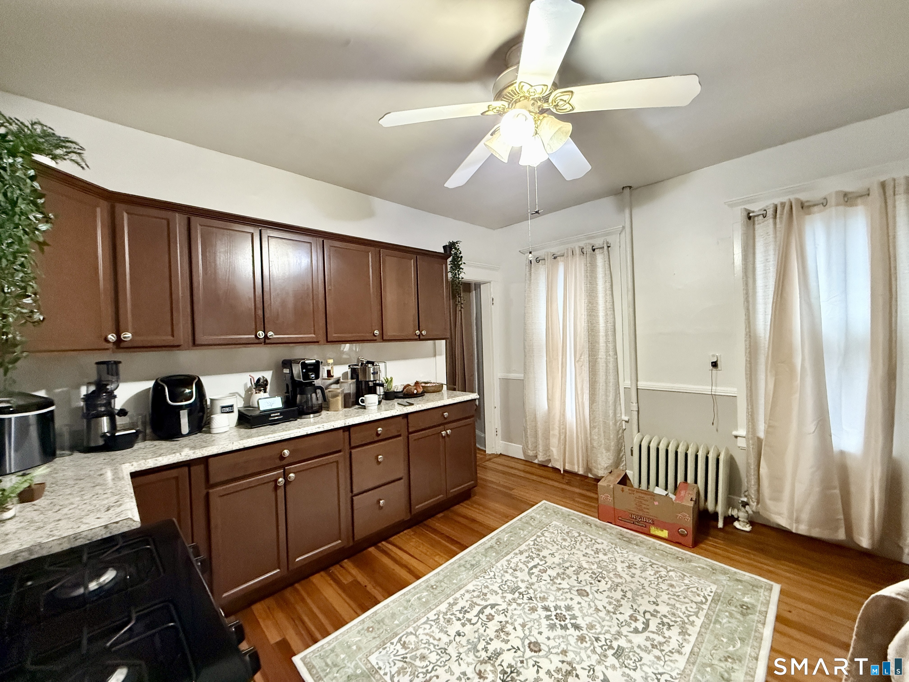 26 Victory Street Bridgeport, CT 06606 - Photo 5 of 32 a kitchen with stainless steel appliances granite countertop a sink stove and refrigerator