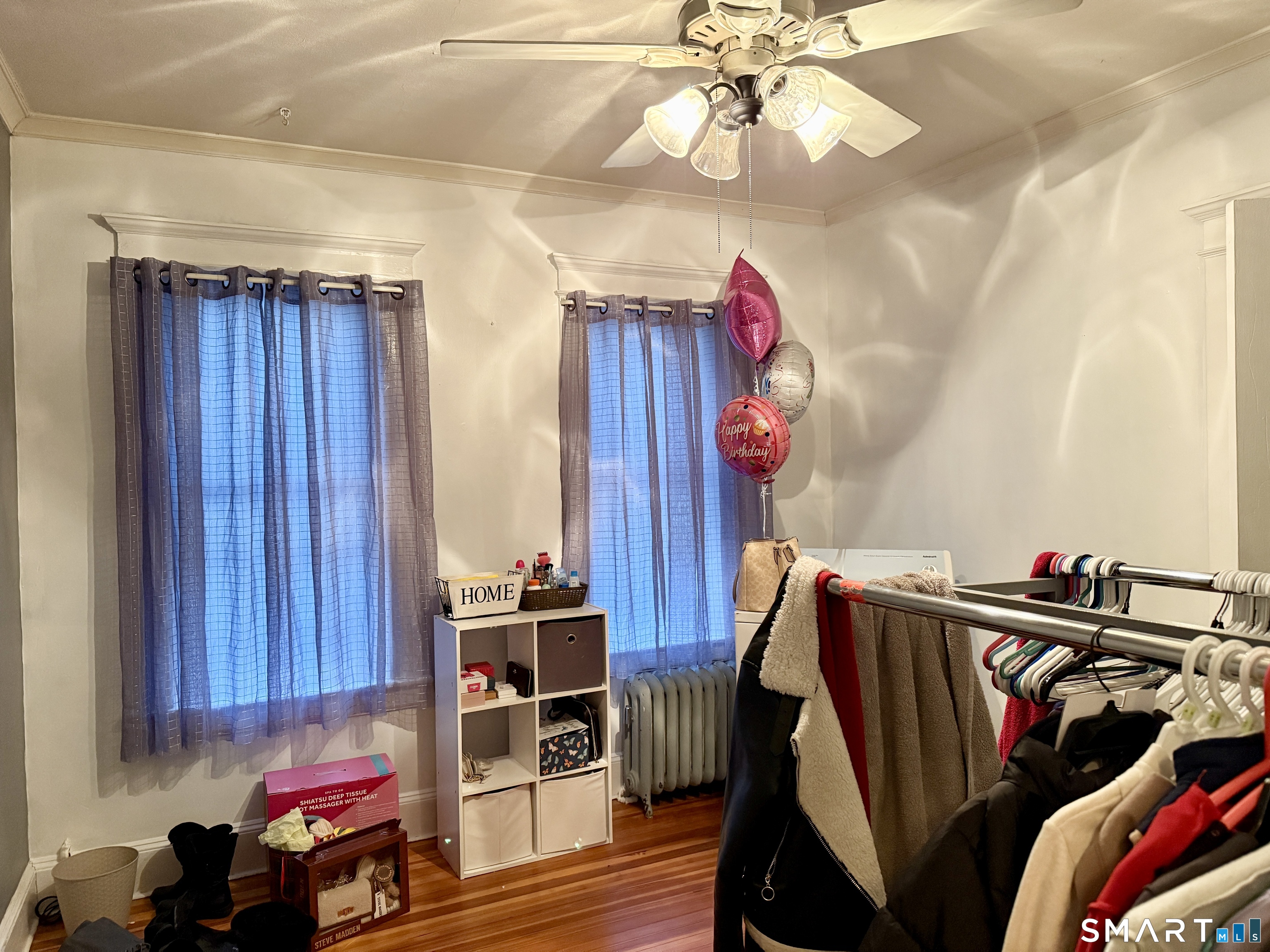 26 Victory Street Bridgeport, CT 06606 - Photo 10 of 32 a view of walk in closet with clothes and shoes