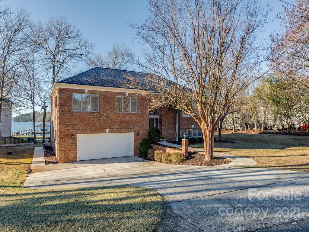 8683 Howard Drive Terrell, NC 28682 - Photo 12 of 46 a view of a house with a yard and a large tree