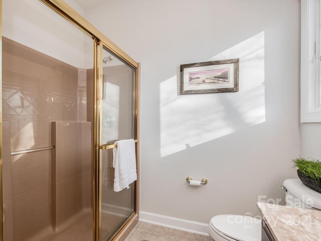 8683 Howard Drive Terrell, NC 28682 - Photo 27 of 46 a white toilet sitting next to a bathroom sink