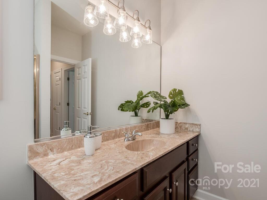 8683 Howard Drive Terrell, NC 28682 - Photo 28 of 46 a dining table with a mirror and a sink