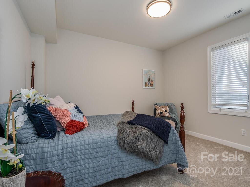 8683 Howard Drive Terrell, NC 28682 - Photo 32 of 46 a bedroom with a bed and a window