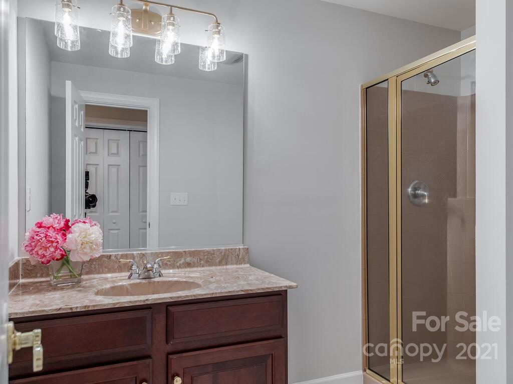 8683 Howard Drive Terrell, NC 28682 - Photo 36 of 46 a bathroom with a sink vanity and a mirror