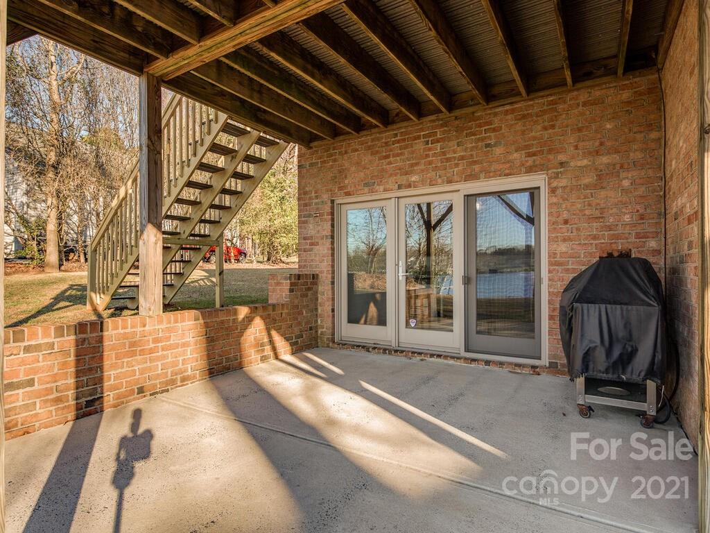 8683 Howard Drive Terrell, NC 28682 - Photo 40 of 46 a view of a porch with furniture and floor to ceiling window