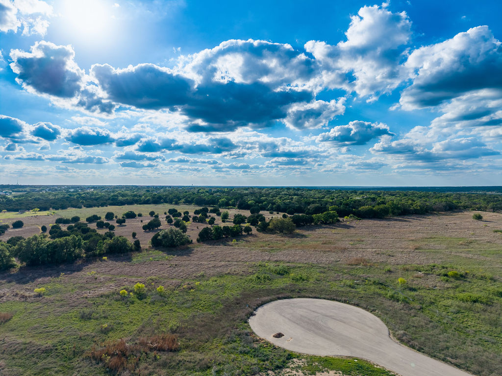 177 West Rio Ranch Road Liberty Hill, TX 78642 - Photo 16 of 30 a view of a golf course with a lake