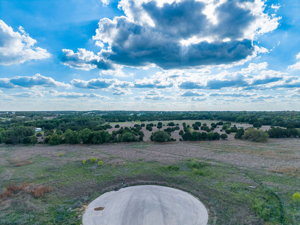 177 West Rio Ranch Road Liberty Hill, TX 78642 - Photo 2 of 30 a view of a garden with a house in the background