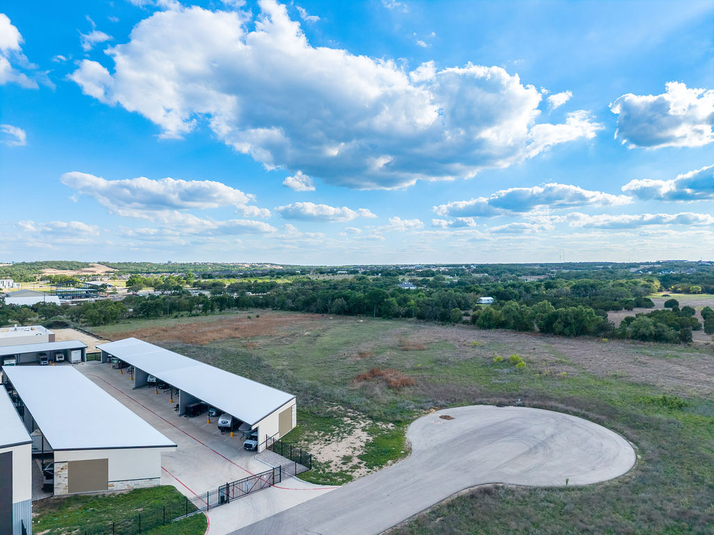 177 West Rio Ranch Road Liberty Hill, TX 78642 - Photo 7 of 30 an aerial view of a house with big yard