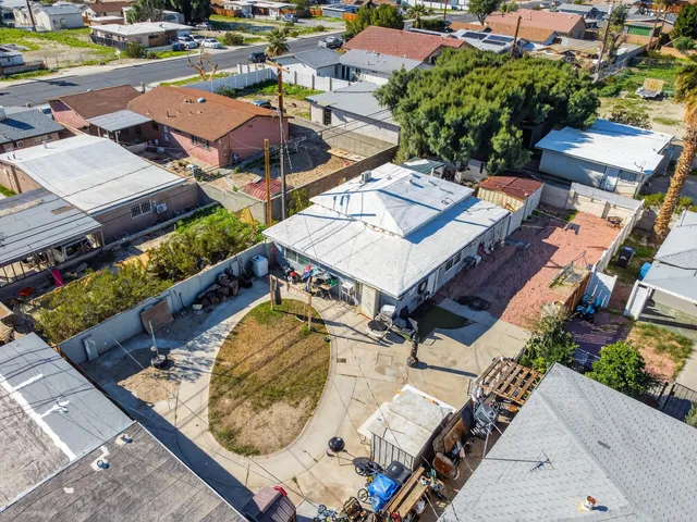 an aerial view of a house with a ocean view
