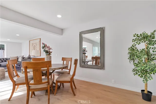 a view of a dining room with furniture and window
