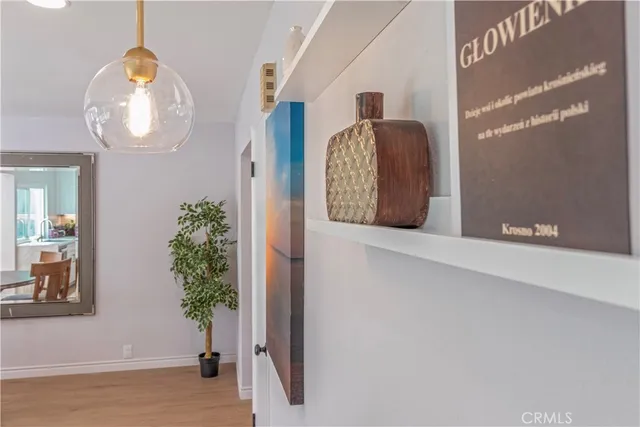 a view of staircase with wooden floor and potted plant